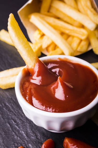 meal with ketchup and fries meal with fries and ketchup on a slate plate alimentazione non salutare stock pictures, royalty-free photos & images