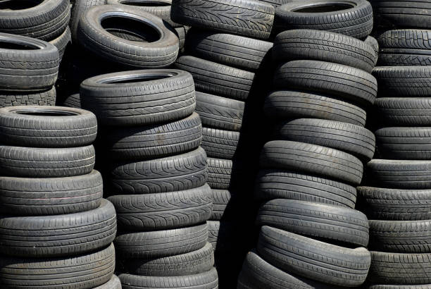 stack of worn tires stack of worn tires of different types pila stock pictures, royalty-free photos & images