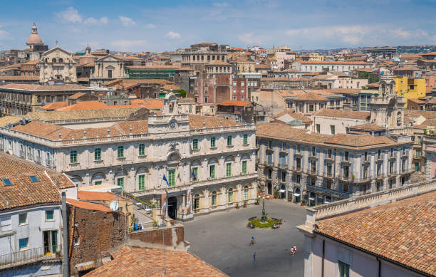 panoramic sight in catania from the dome of the badia di sant'agata, with the church of san benedetto facade and the dome of san nicolò l'arena. sicily, italy. - l unesco imagens e fotografias de stock