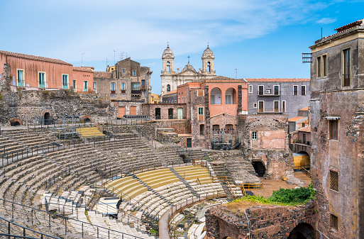 The roman theater in Catania, with the Church of St. Francis of Assisi on the background. Sicily. Italy.