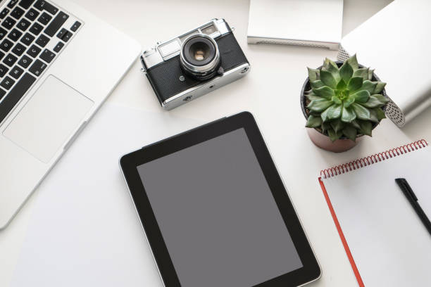 istock Home office desk with laptop, Photographer's equipments 1125983191