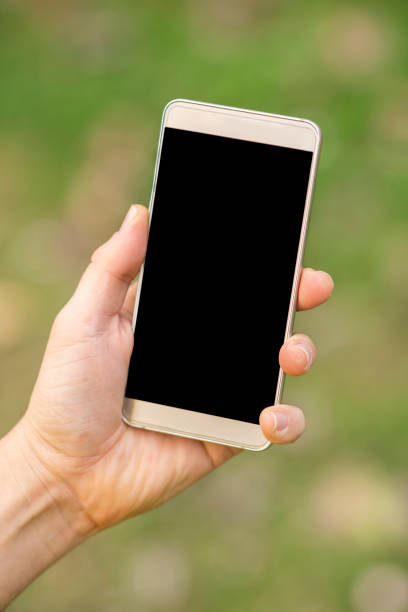 istock Close up of man holding smartphone 1125983689