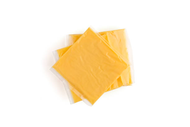 istock Melted cheese on a white background. Slices of melted cheese close-up on a white background. 1125984805