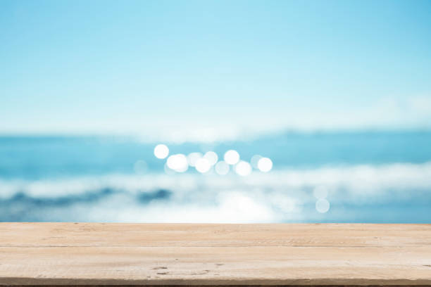 istock Empty Wooden Planks with Blur Beach on Background 1125987082