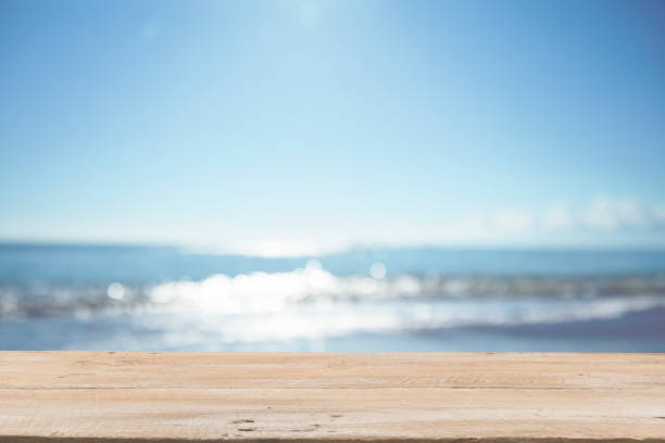 istock Empty Wooden Planks with Blur Beach on Background 1125987089