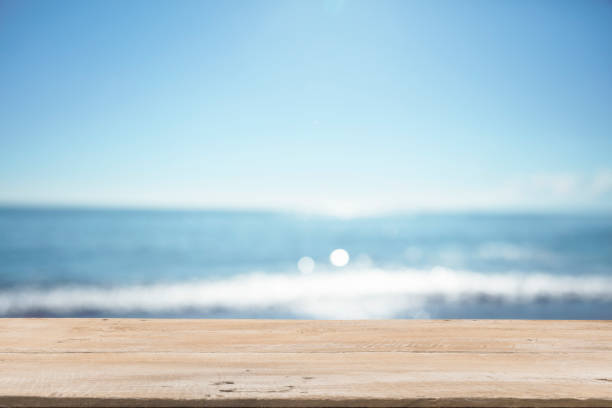 istock Empty Wooden Planks with Blur Beach on Background 1125987095