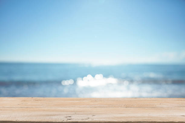 istock Empty Wooden Planks with Blur Beach on Background 1125987097