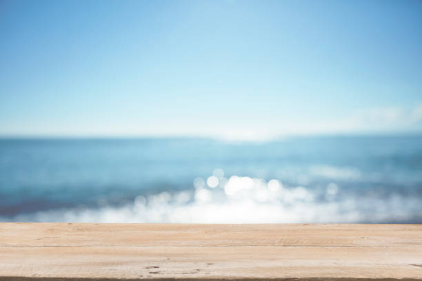 istock Empty Wooden Planks with Blur Beach on Background 1125987113