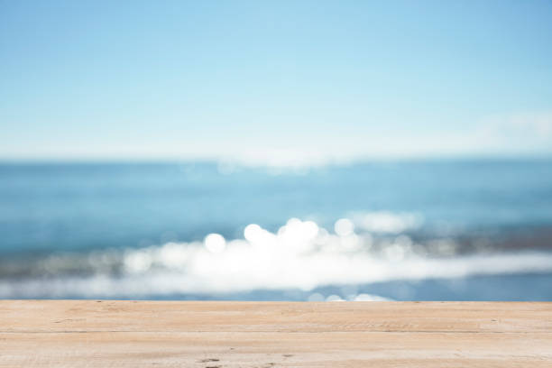 istock Empty Wooden Planks with Blur Beach on Background 1125987117