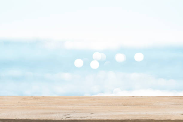 istock Empty Wooden Planks with Blur Beach on Background 1125987119
