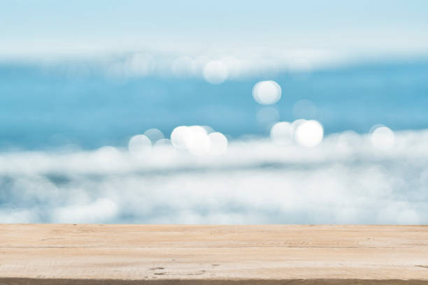 istock Empty Wooden Planks with Blur Beach on Background 1125987134