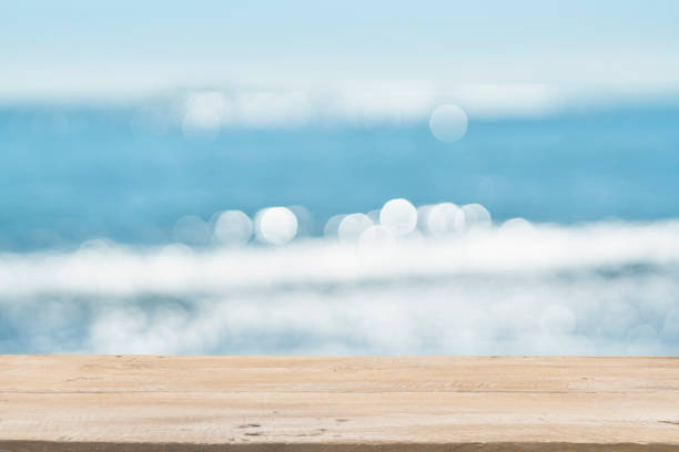 istock Empty Wooden Planks with Blur Beach on Background 1125987135
