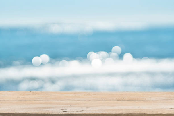 istock Empty Wooden Planks with Blur Beach on Background 1125987140