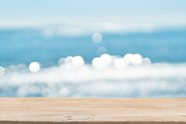 istock Empty Wooden Planks with Blur Beach on Background 1125987142