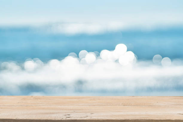 istock Empty Wooden Planks with Blur Beach on Background 1125987145