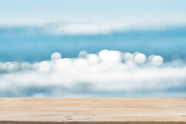 istock Empty Wooden Planks with Blur Beach on Background 1125987150