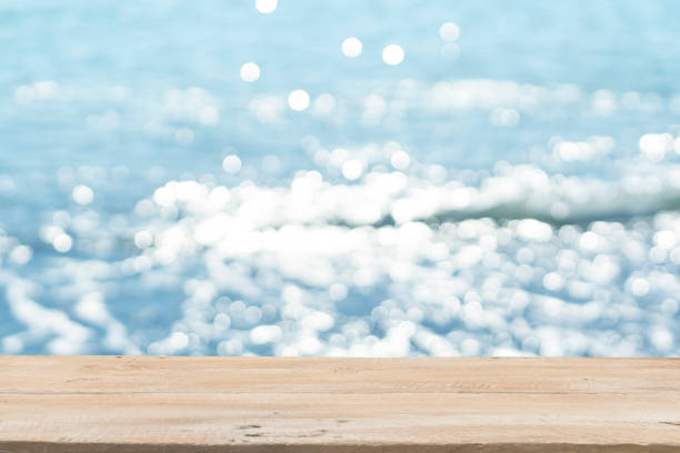 istock Empty Wooden Planks with Blur Beach on Background 1125987154