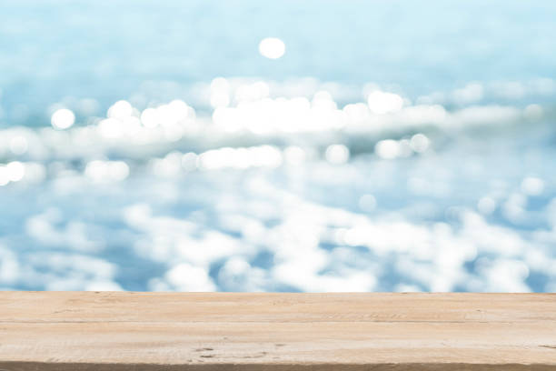 istock Empty Wooden Planks with Blur Beach on Background 1125987168