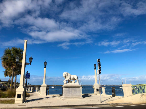 A Medici lion at St Augustine, Florida , USA A  Medici lion guards the Bridge of Lions, with the Matanzas River in the background at St Augustine, Florida, the oldest city in the USA bridge of lions stock pictures, royalty-free photos & images