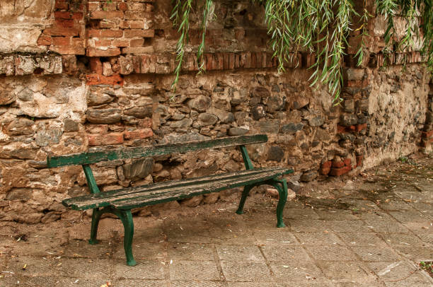 istock Old grunge wooden bench 1125990058