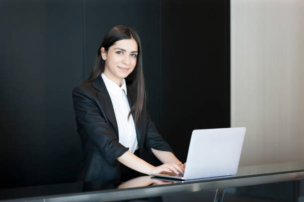 Receptionists at work Receptionists at work hotel reception hotel business lobby stock pictures, royalty-free photos & images