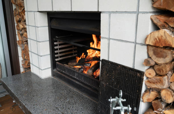istock Outdoor fireplace setting at modern holiday home 1125993074