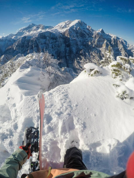 Snowboarder hiking in Alps
