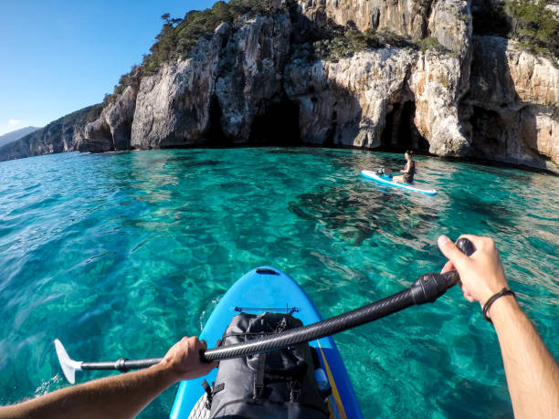 Couple stand up paddling