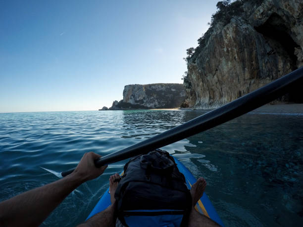 istock Stand up paddling towards a sunny beach 1125993264