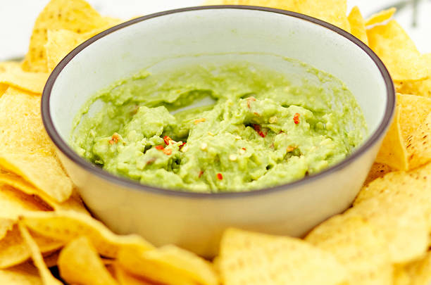 istock Bowl of guacamole and nachos 1125993362