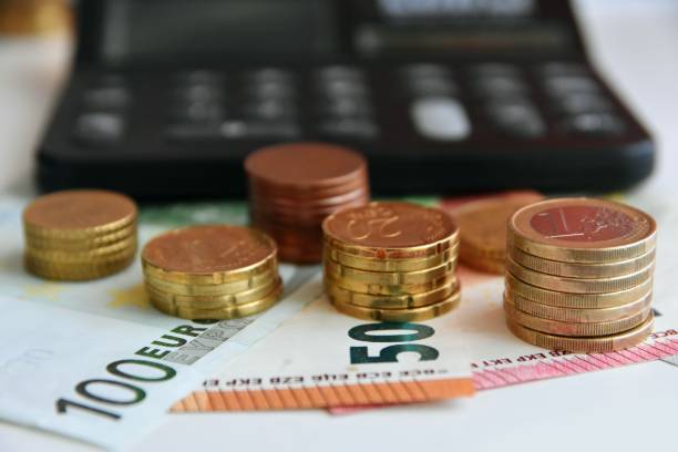 istock Euro bills and coins 1125994242