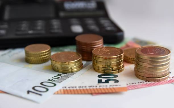 istock Euro bills and coins 1125994250