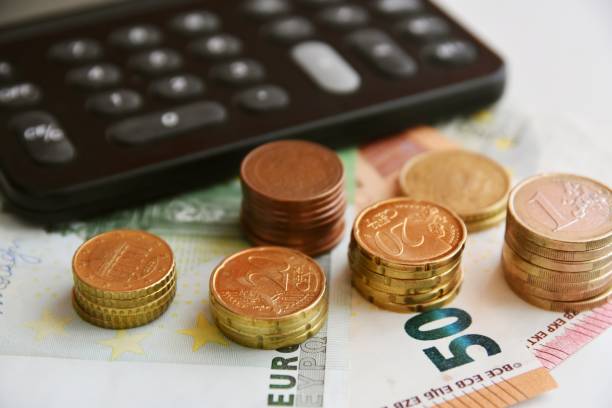 istock Euro bills and coins 1125994630