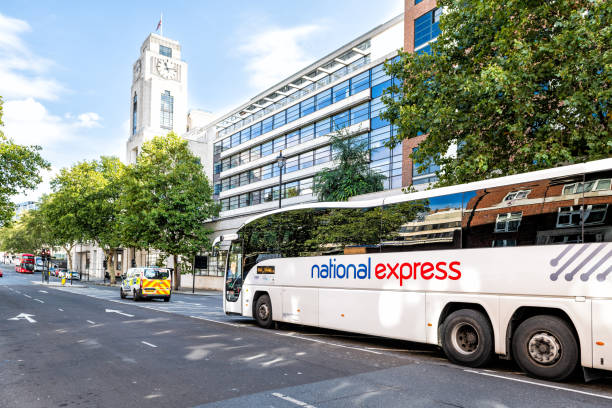 National Express shuttle bus parked white sign text transport service on street road by Victoria Coach Station exterior building London, UK - September 15, 2018: National Express shuttle bus parked white sign text transport service on street road by Victoria Coach Station exterior building national express stock pictures, royalty-free photos & images