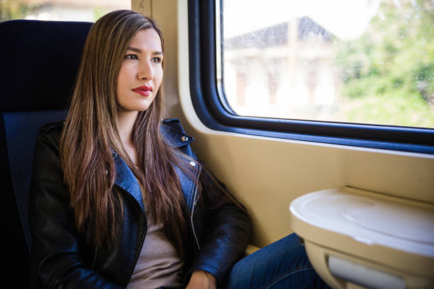 istock Thoughtful woman in train 1125997709