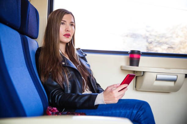istock Tourist on the train using mobile phone 1125997716