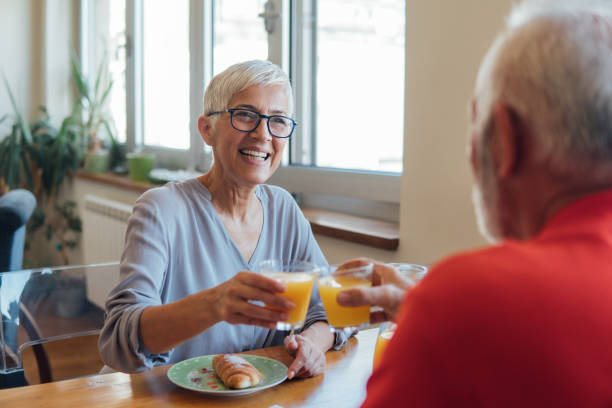 istock Senior couple having breakfast at home 1125998129