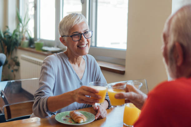 istock Senior couple drinking orange juice 1125999446