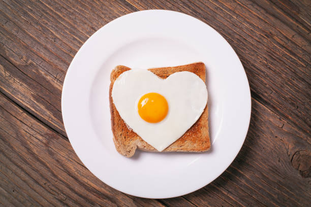 istock Breakfast on Valentine's Day on rustic wooden table. 1126000760