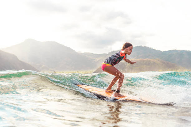 Cute little girl surfing