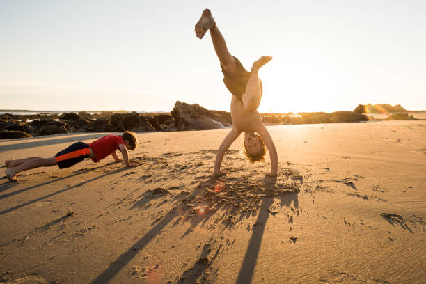 istock Children exercising on the beach 1126011082