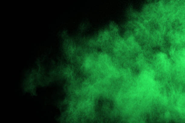 istock Green powder explosion on black background. Colored cloud. Colorful dust explode. Paint Holi. 1126016103
