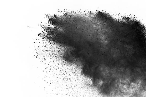 istock Black powder explosion. Closeup of black dust particles explode isolated on white background. 1126016119