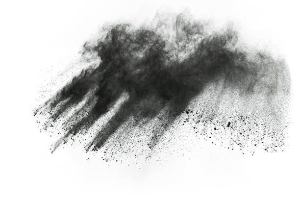 istock Black powder explosion. Closeup of black dust particles explode isolated on white background. 1126016130
