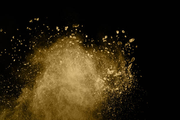 istock Golden powder explosion on black background. Freeze motion. 1126016194