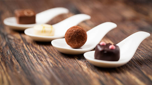 delicious pralines on spoons