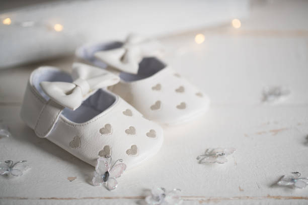 istock baby shoes on white vintage background 1126016955