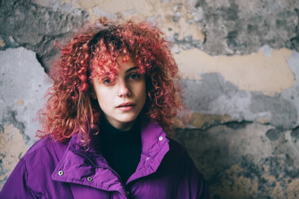 istock Girl with curly red hair 1126021474