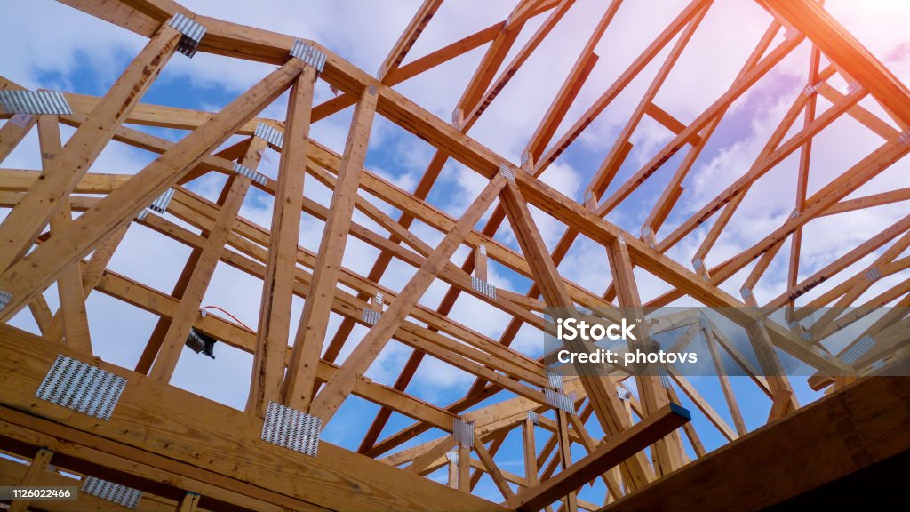 Residential home framing view on new house wooden under construction Residential construction home framing view on new house wooden under construction Construction Industry Stock Photo