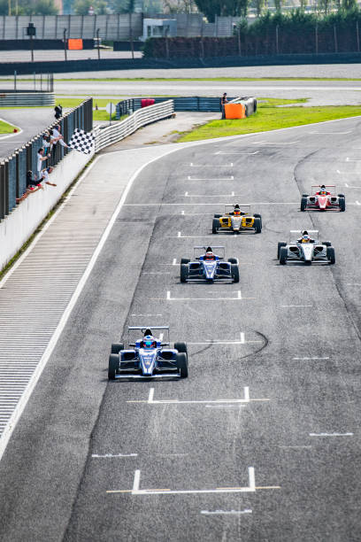 istock Formula race cars on the home stretch 1126024080